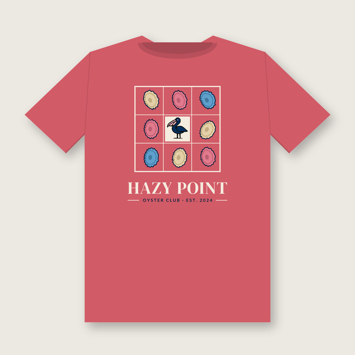 Back of the watermelon-pink Hazy Point Oyster Club Tee: a grid of eight sand, rose and sky oyster shells around a pelican, with HAZY POINT and EST. 2024 beneath