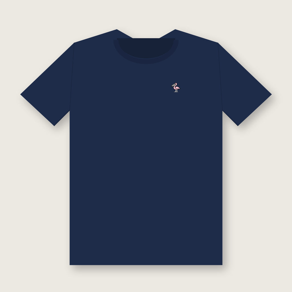 Front of the navy Collegiate Arch Tee with a small light-pink pelican with a white bill on the left chest