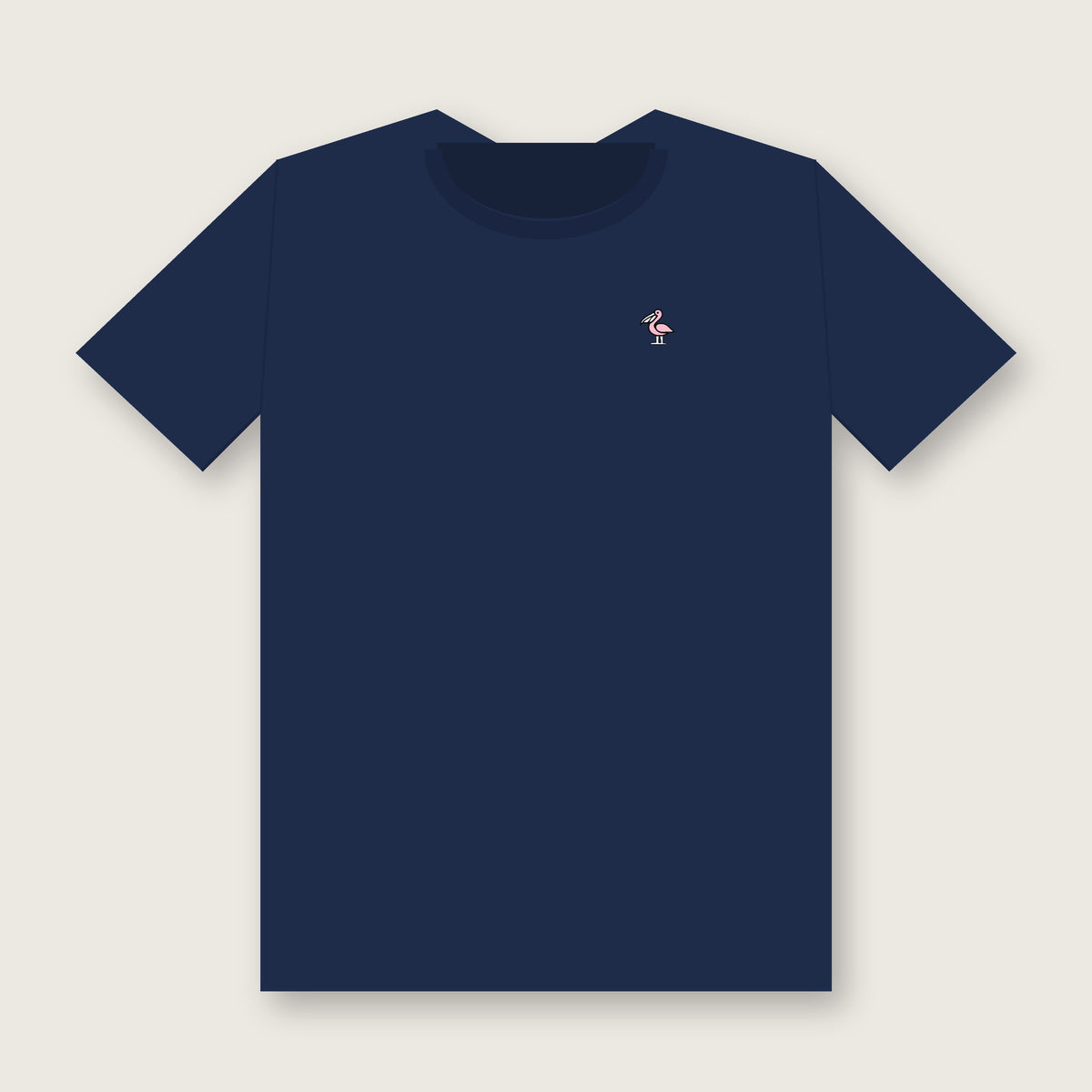 Front of the navy Collegiate Arch Tee with a small light-pink pelican with a white bill on the left chest