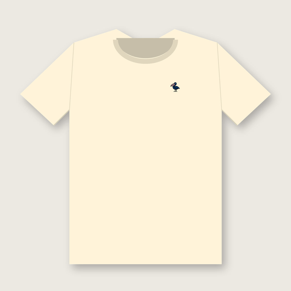 Front of the ivory Links Club golf tee with a small navy pelican with a pink bill on the left chest